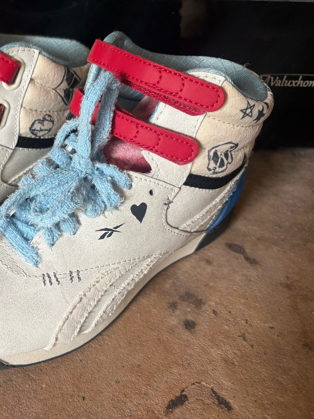 Reebok Harley Quinn Sneakers with Red Straps and Pastel Blue/Pink Accents
